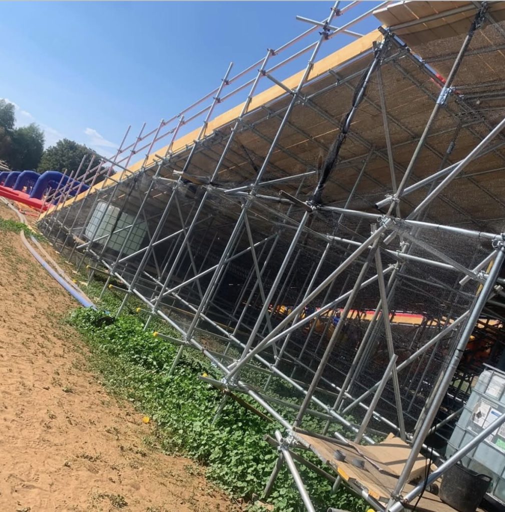 Netted and braced scaffold structure supporting the Slip n Slide lanes at Millets Farm